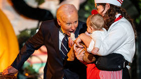 Biden biting babies on Halloween (WATCH)